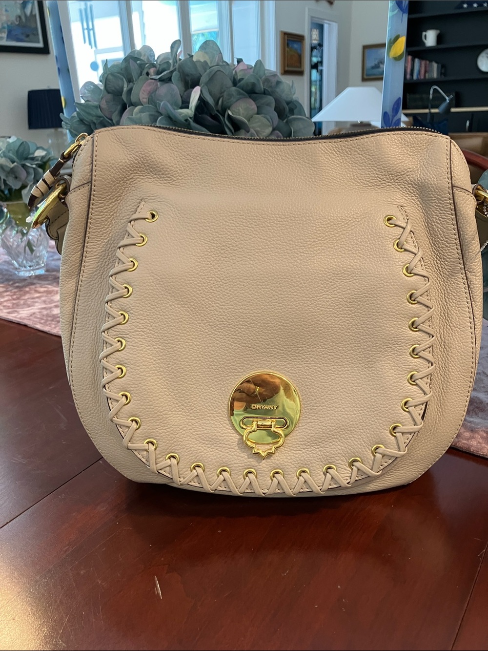 Beautiful Unique Oryany Janessa 100% leather cream saddle bag